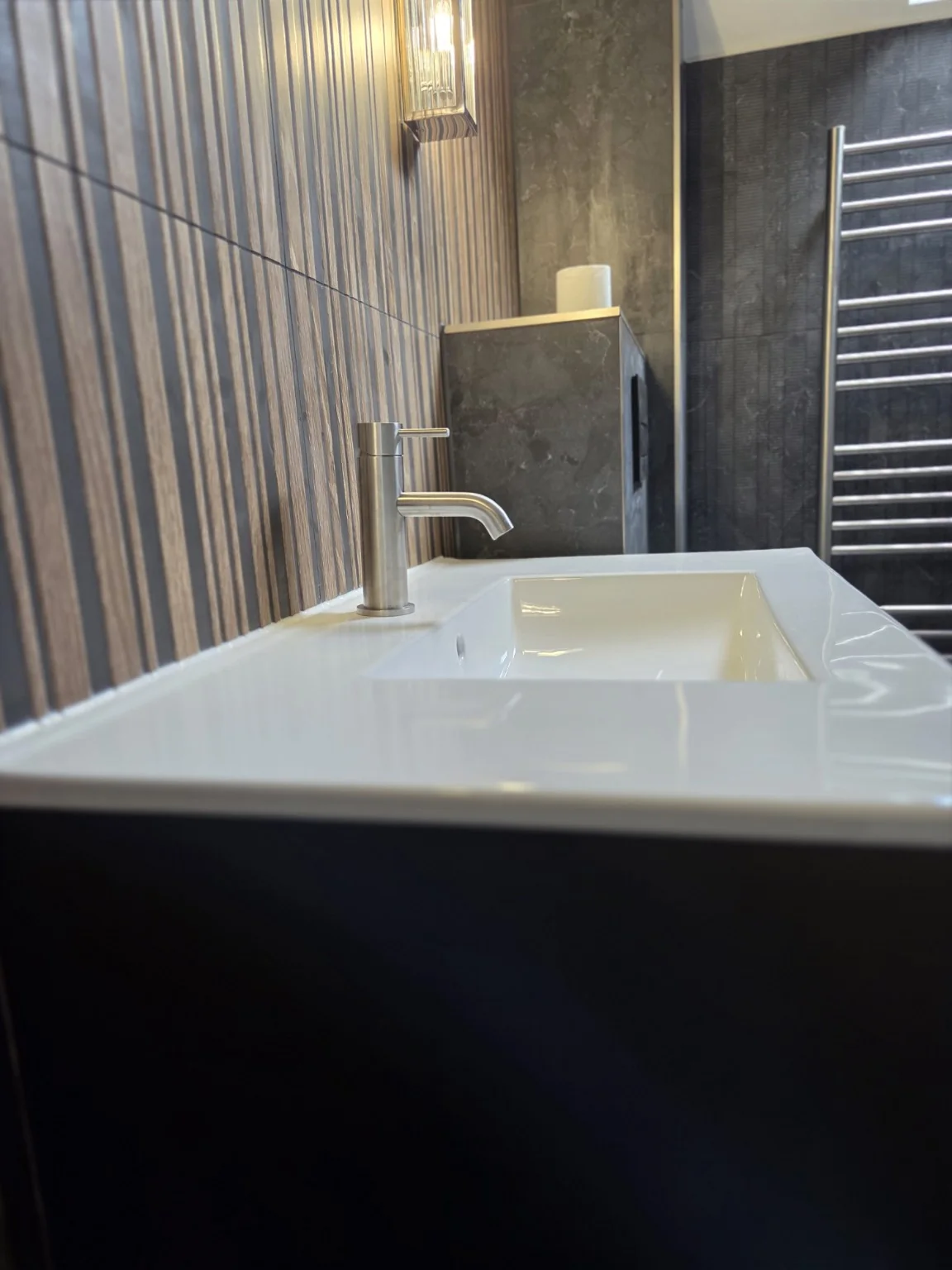 Vanity and brushed metal basin tap