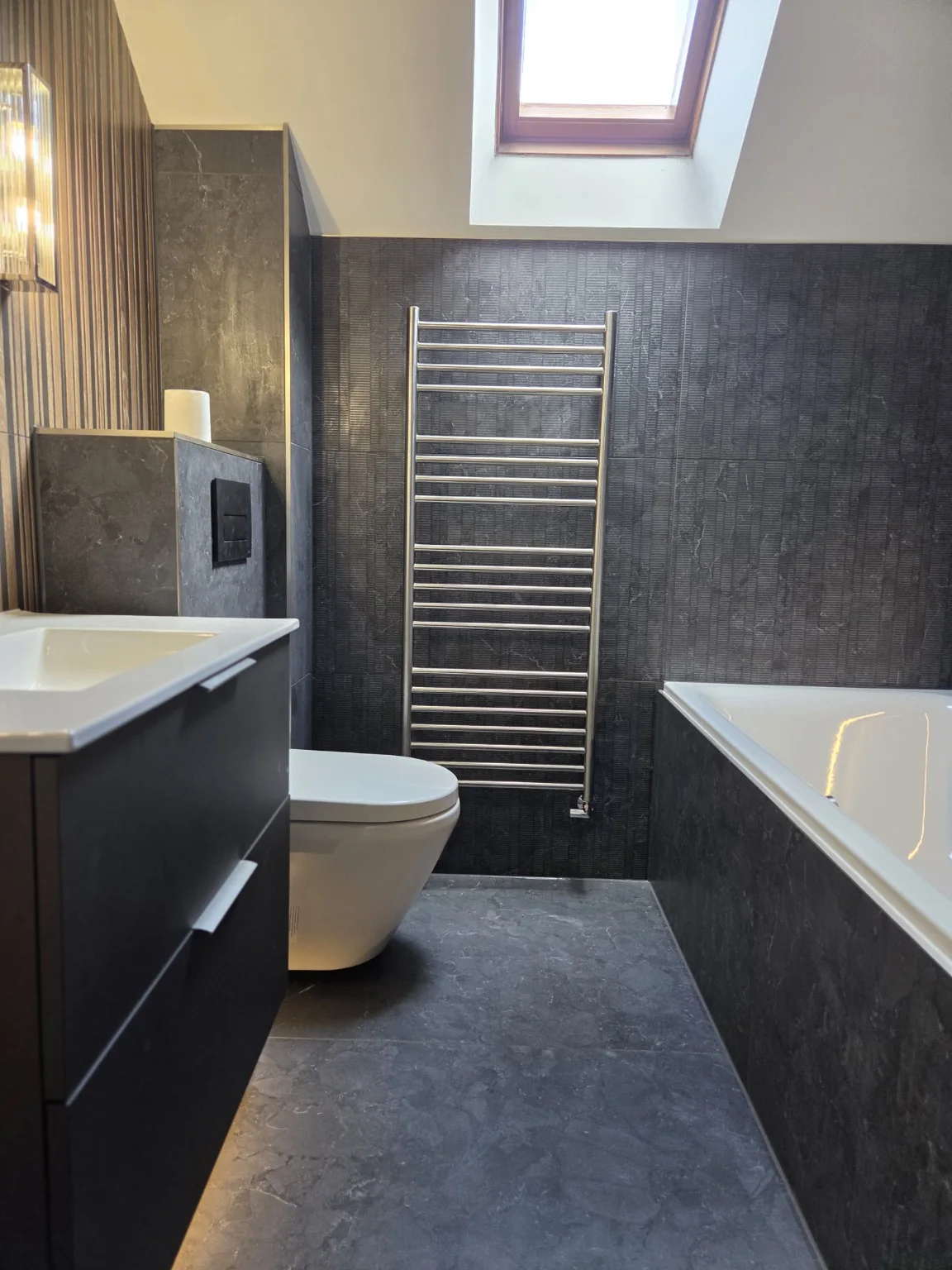 Charcoal bathroom with skylight