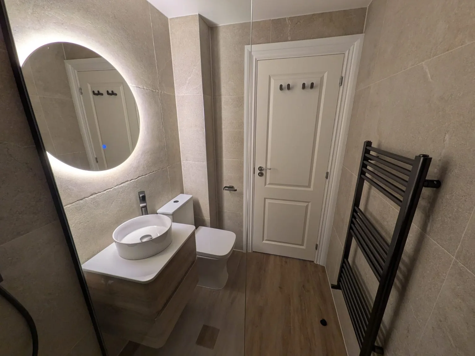 Grey bathroom with gold fittings