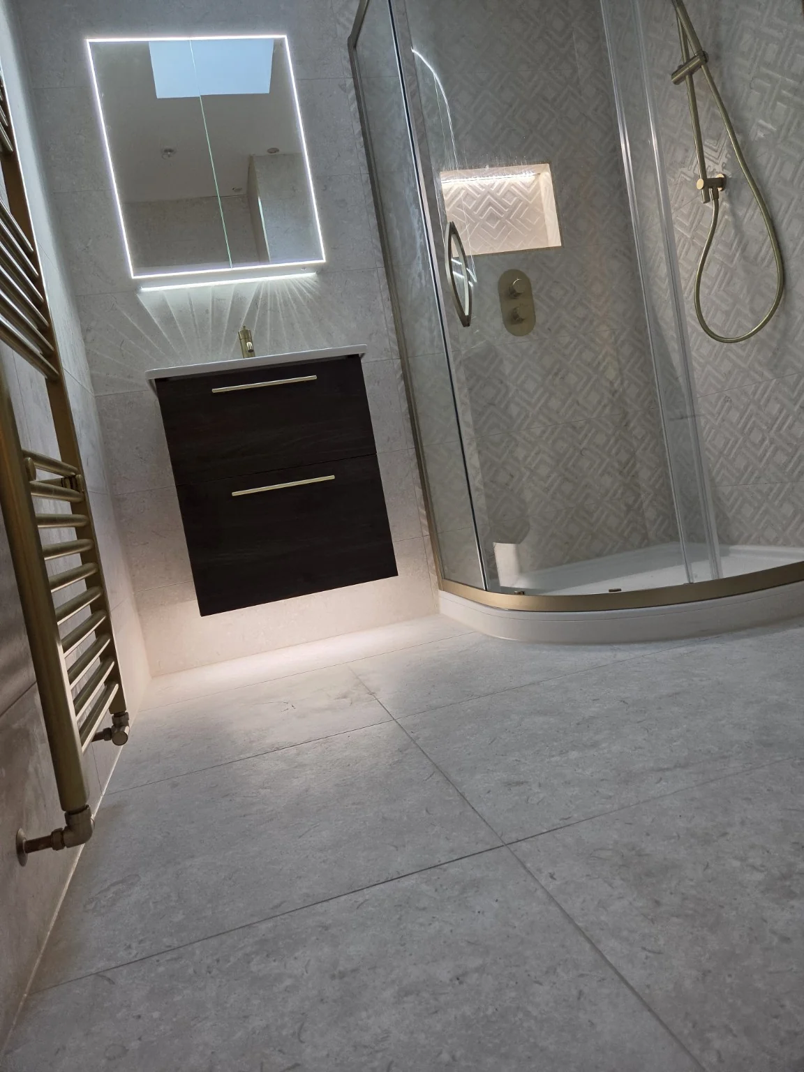Floating vanity and brushed gold tap