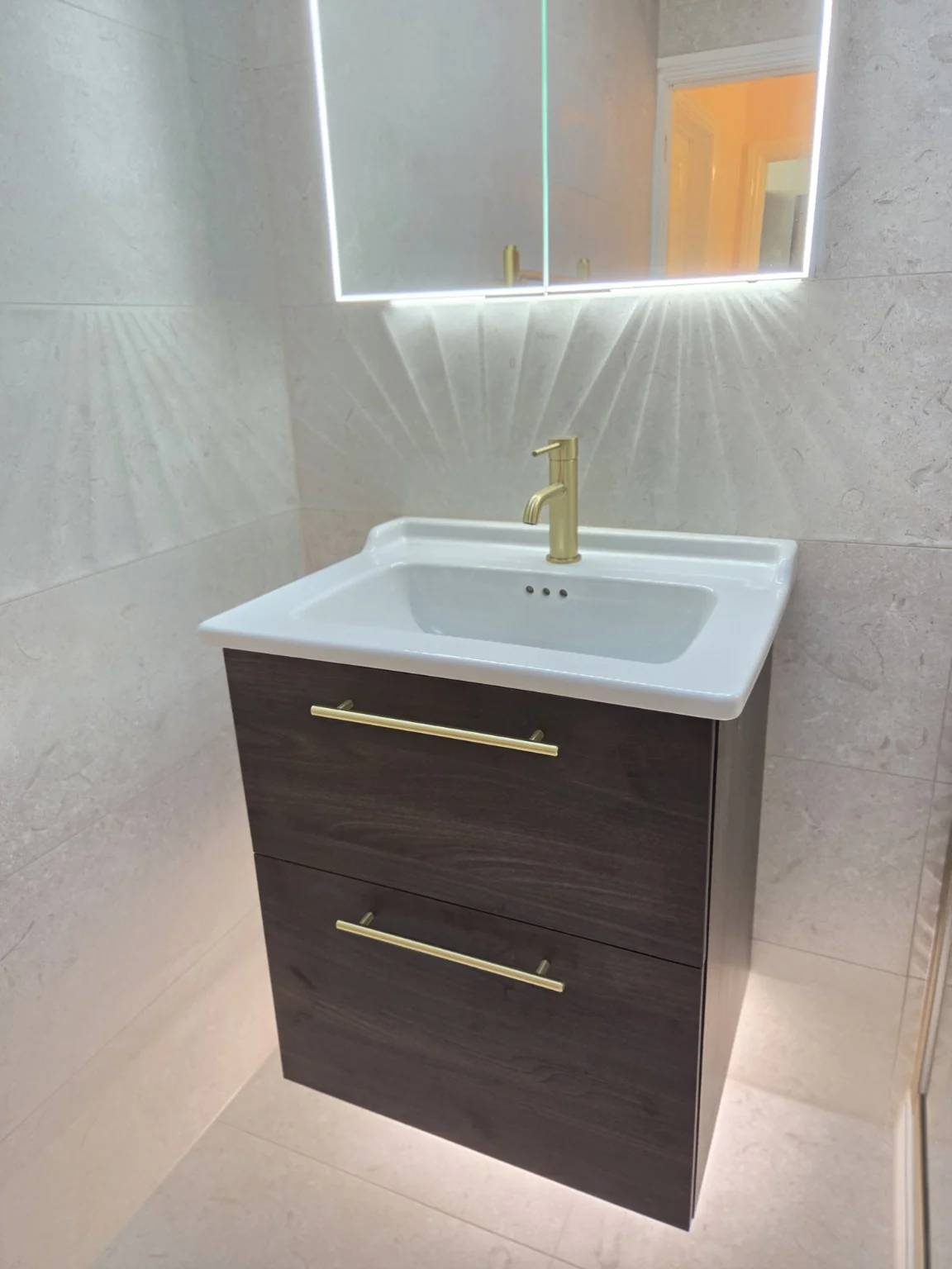 Floating vanity and shower enclosure