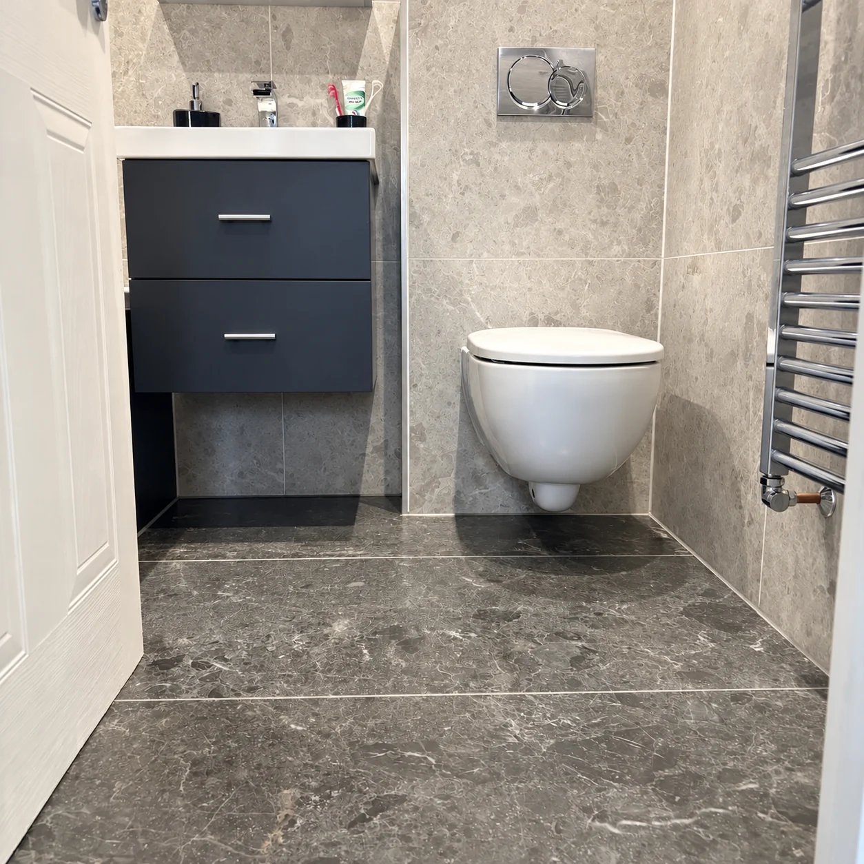 Stone and charcoal bathroom vanity and toilet