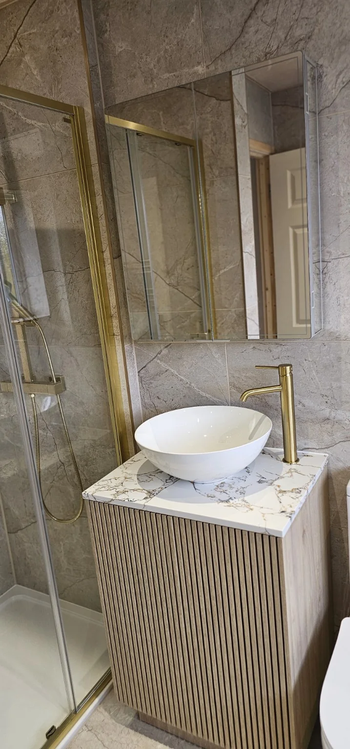 Fluted vanity with vessel basin and brushed gold tap